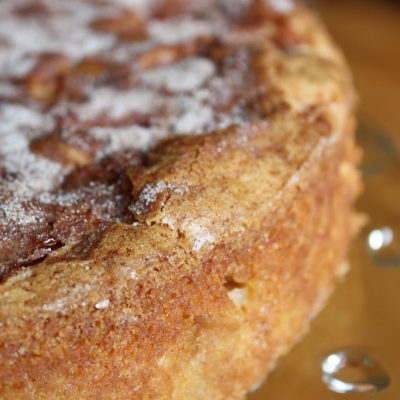 This dense, sweet cake is studded with bits of tart apple and topped with cinnamon and sugar.