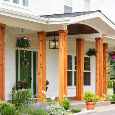 We turned the plain white front porch pillars into cedar pillars, and our porch has never looked better.