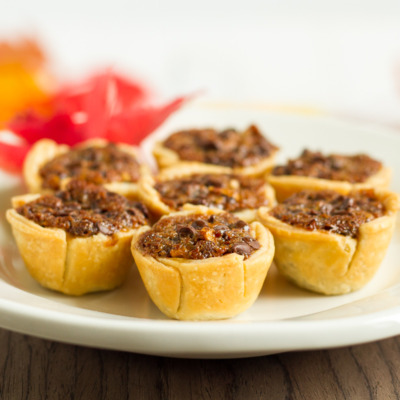 These mini chocolate pecan pies are delicious and easy to make. They're a perfect addition to your Thanksgiving or Friendsgiving dessert table!