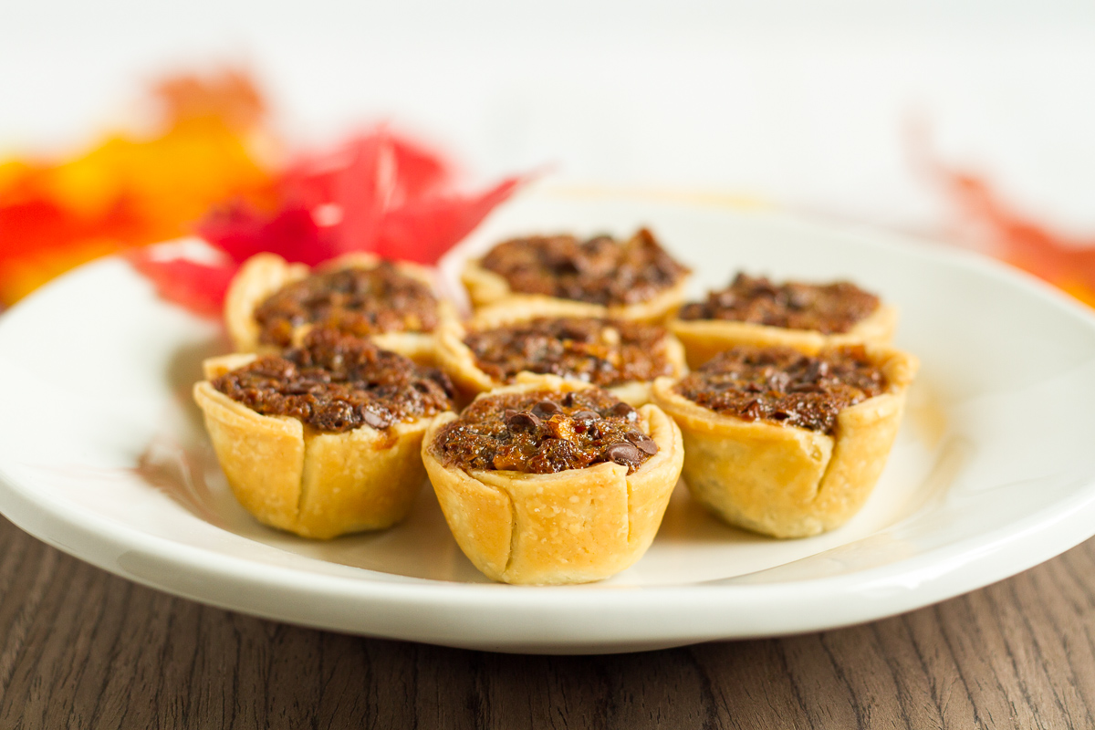 These mini chocolate pecan pies are delicious and easy to make. They're a perfect addition to your Thanksgiving or Friendsgiving dessert table!