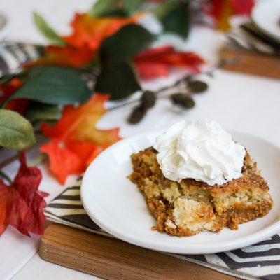 Pumpkin pie cake is a long-time family favorite from both my mom and my mother-in-law. A layer of pumpkin custard is topped with a crumbly cake layer, melted butter, crunchy pecans, and a sprinkle of cinnamon. The perfect dessert for fall!