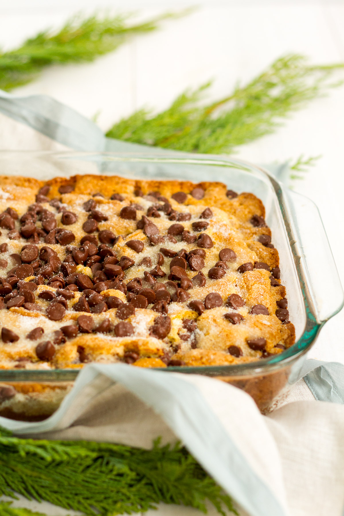 A delicious and easy vanilla cake filled with chocolate chips. A layer of granulated sugar on top makes it extra delicious! From the book New England Invite by Kate Bowler