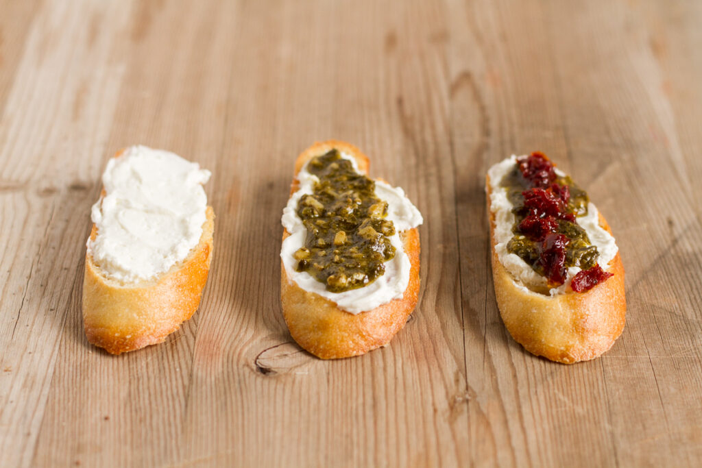 pesto and sun-dried tomato crostini are perfect for the holidays